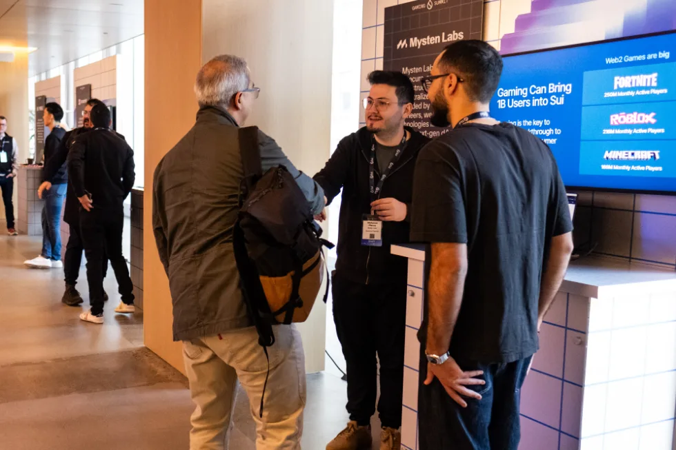 Engineers and product leaders collaborating at an event