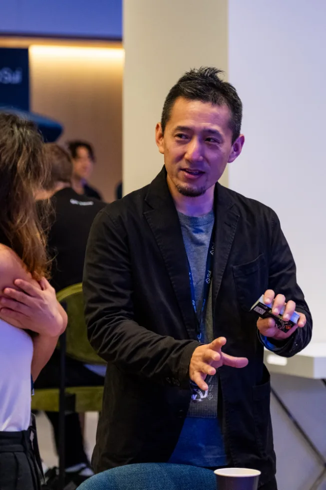 A technology speaker presenting during a builder event